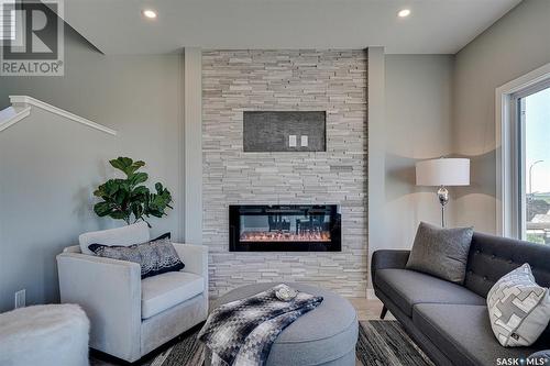 3225 Green Turtle Road, Regina, SK - Indoor Photo Showing Living Room With Fireplace