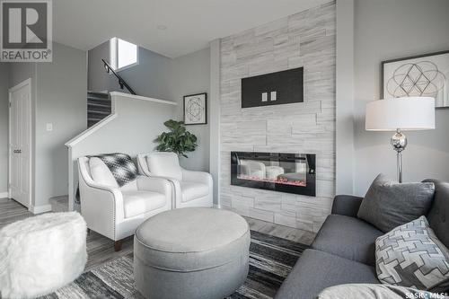 3225 Green Turtle Road, Regina, SK - Indoor Photo Showing Living Room With Fireplace