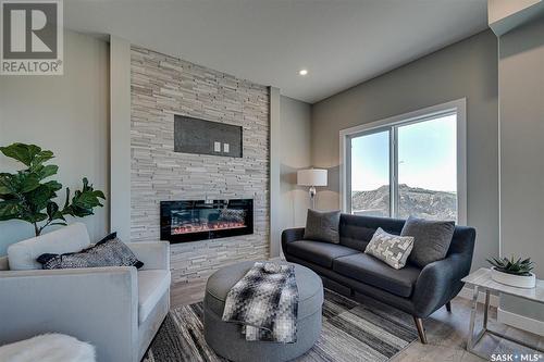 3225 Green Turtle Road, Regina, SK - Indoor Photo Showing Living Room With Fireplace