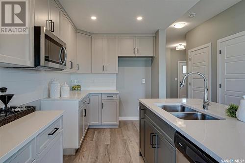 3225 Green Turtle Road, Regina, SK - Indoor Photo Showing Kitchen With Double Sink