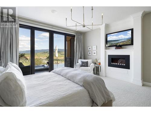 328 Cordon Place, Vernon, BC - Indoor Photo Showing Bedroom With Fireplace