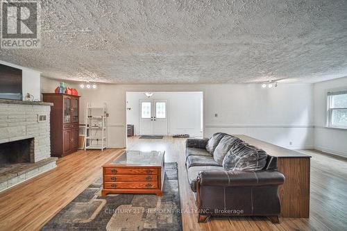 15 Leslie Frost Lane, Kawartha Lakes, ON - Indoor Photo Showing Living Room With Fireplace