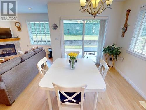 16-4897 Ontario Ave, Powell River, BC - Indoor Photo Showing Dining Room With Fireplace