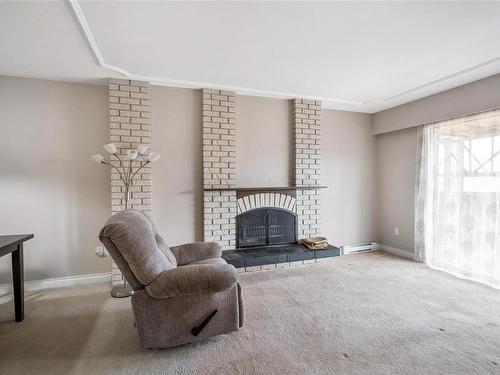 204-3244 Seaton St, Saanich, BC - Indoor Photo Showing Living Room With Fireplace