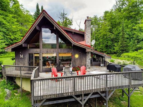 FaÃ§ade - 300 Ch. Du Lac-Grand, Val-Des-Monts, QC - Outdoor With Deck Patio Veranda
