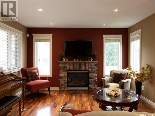 4518 Cudmore Crescent, Regina, SK - Indoor Photo Showing Living Room With Fireplace