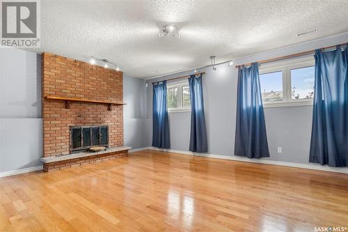 127 Delaronde Road, Saskatoon, SK - Indoor Photo Showing Living Room With Fireplace