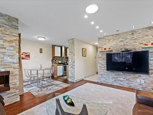 107-2035 Baron Road, Kelowna, BC - Indoor Photo Showing Living Room With Fireplace