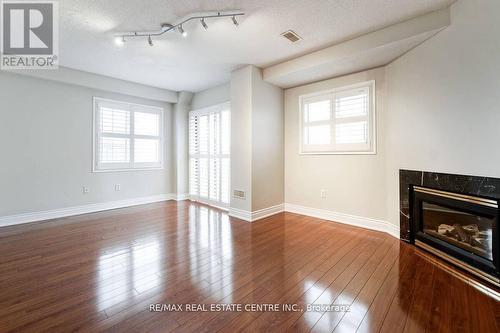 82 - 1480 Britannia Road W, Mississauga, ON - Indoor Photo Showing Other Room With Fireplace