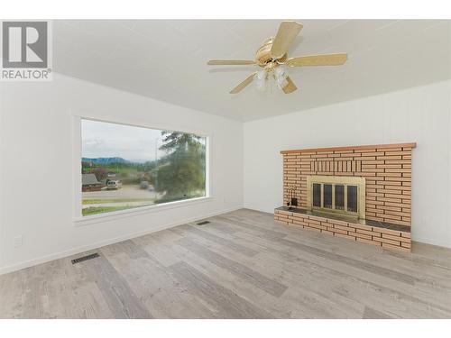 174 Salmon Arm Drive, Enderby, BC - Indoor Photo Showing Living Room With Fireplace