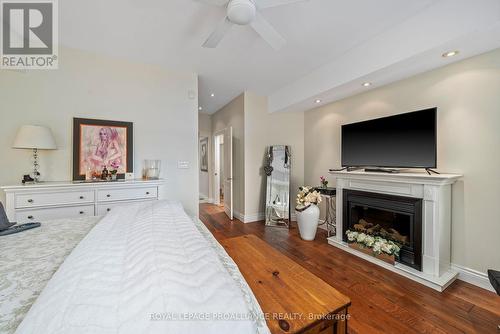 17B Hughes Lane, Tweed, ON - Indoor Photo Showing Bedroom With Fireplace