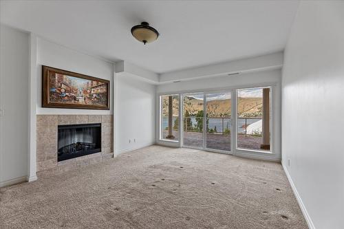 301-7922 Okanagan Landing Road, Vernon, BC - Indoor Photo Showing Other Room With Fireplace