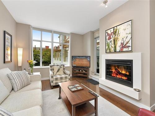 215-999 Burdett Ave, Victoria, BC - Indoor Photo Showing Living Room With Fireplace
