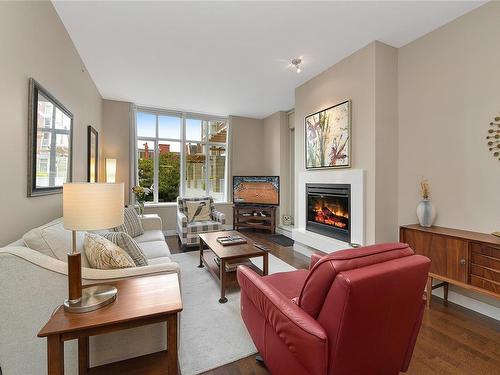 215-999 Burdett Ave, Victoria, BC - Indoor Photo Showing Living Room With Fireplace