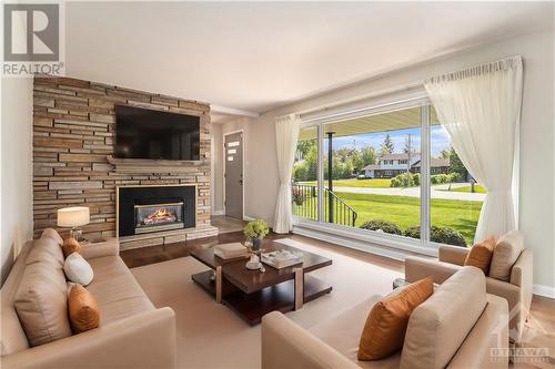 54 Wabalac Drive, Arnprior, ON - Indoor Photo Showing Living Room With Fireplace