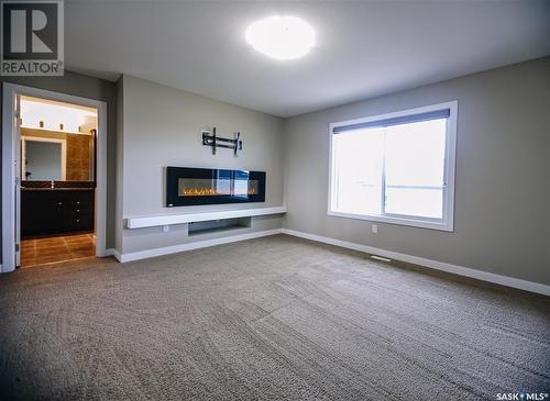 307 Gillies Crescent, Saskatoon, SK - Indoor Photo Showing Other Room With Fireplace