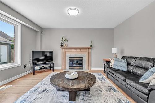 96 Highland Boulevard, Caledonia, ON - Indoor Photo Showing Living Room With Fireplace