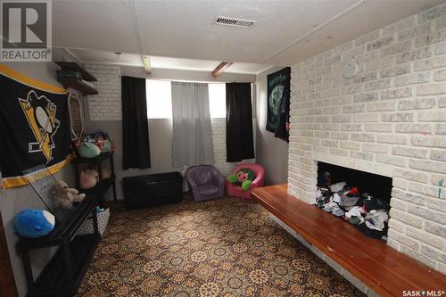 9704 97Th Drive, North Battleford, SK - Indoor Photo Showing Other Room With Fireplace