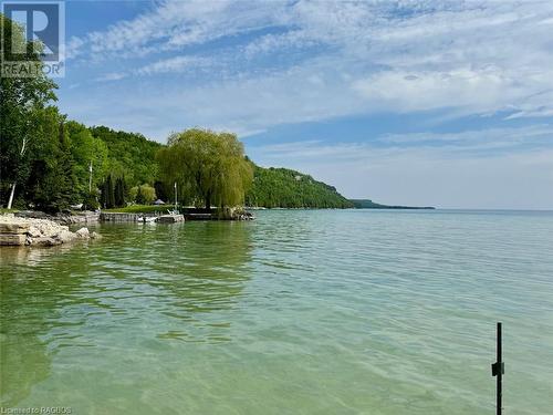 Most of Hope Bay offers incredible protected shoreline area that allows for boat docking and safe water play. - 47 Water Street, Northern Bruce Peninsula, ON - Outdoor With Body Of Water With View