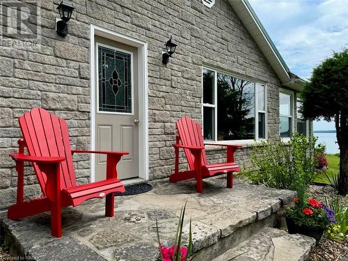 Enter the vacation home through natural 'local' limestone patio. - 47 Water Street, Northern Bruce Peninsula, ON - Outdoor With Deck Patio Veranda