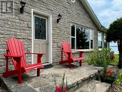 Enter the vacation home through natural 'local' limestone patio. - 