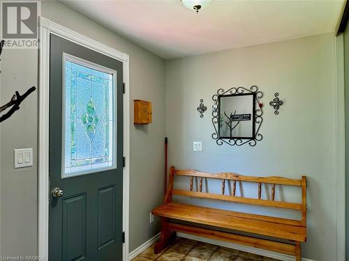 Into a proper entrance foyer offering a large full wall closet. - 47 Water Street, Northern Bruce Peninsula, ON - Indoor Photo Showing Other Room