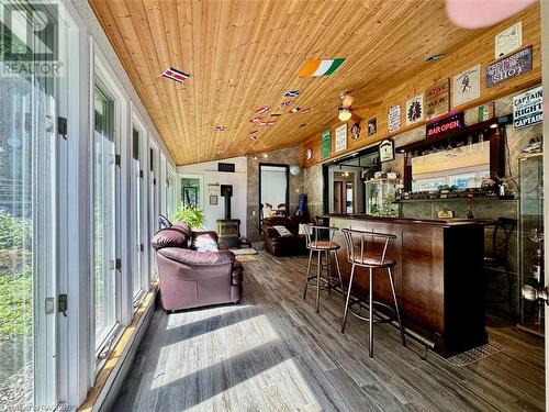 Recreation Room offers a propane fireplace and vaulted wood ceiling. - 47 Water Street, Northern Bruce Peninsula, ON - Indoor Photo Showing Other Room