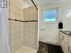 Complete with custom walk-in shower area. - 