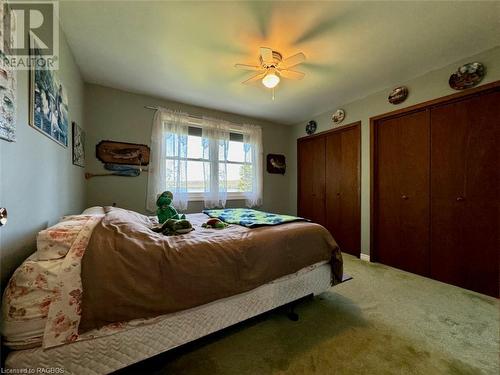 Another large bedroom with double closets and a Georgian Bay water-view. - 47 Water Street, Northern Bruce Peninsula, ON - Indoor Photo Showing Bedroom