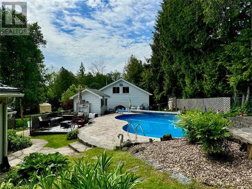 Including the backyard with multiple lounge levels and pool side. - 47 Water Street, Northern Bruce Peninsula, ON - Outdoor With In Ground Pool
