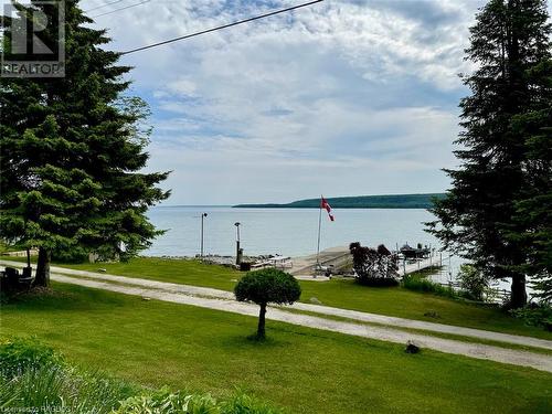Now let's have a closer look at the 167 ft of private Georgian Bay waterfront. - 47 Water Street, Northern Bruce Peninsula, ON - Outdoor With Body Of Water With View