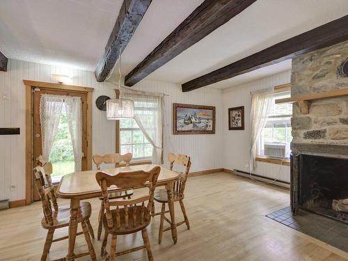 Dining room - 6107 Ch. Vincent-Massey, Rawdon, QC - Indoor Photo Showing Dining Room With Fireplace