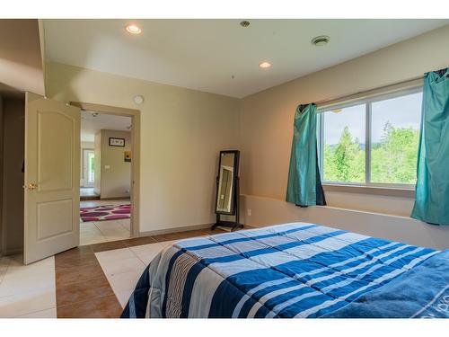 4621 Carlson East Road, Nelson, BC - Indoor Photo Showing Bedroom