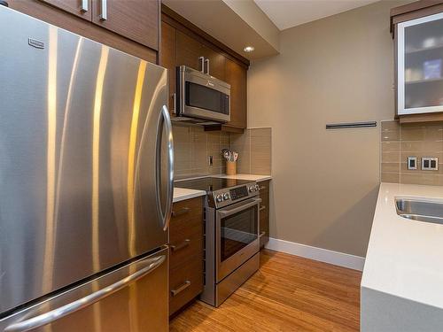 205-2589 Penrhyn St, Saanich, BC - Indoor Photo Showing Kitchen With Double Sink