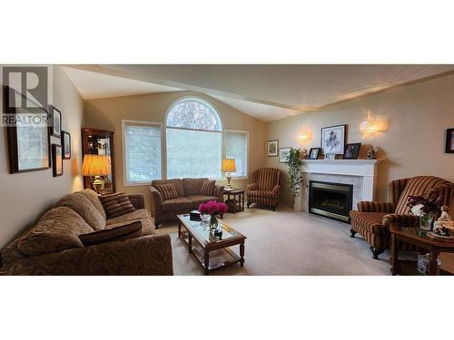 7501 Devito  Drive, Trail, BC - Indoor Photo Showing Living Room With Fireplace