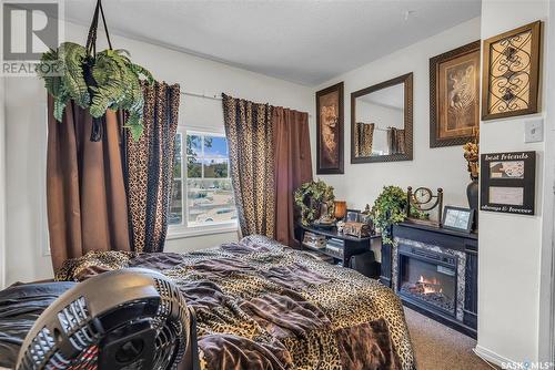 931 7Th Avenue N, Saskatoon, SK - Indoor Photo Showing Bedroom With Fireplace