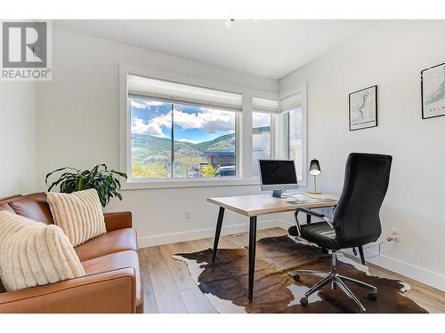 1628 Carnegie Street, Kelowna, BC - Indoor Photo Showing Dining Room With Fireplace