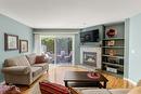 7-1645 Ufton Court, Kelowna, BC  - Indoor Photo Showing Living Room With Fireplace 