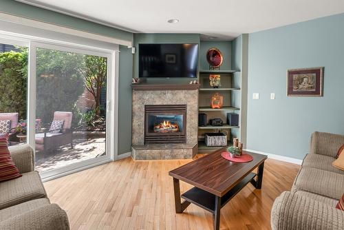 7-1645 Ufton Court, Kelowna, BC - Indoor Photo Showing Living Room With Fireplace