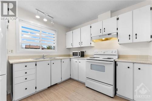 102 Chimo Drive, Kanata, ON - Indoor Photo Showing Kitchen With Double Sink