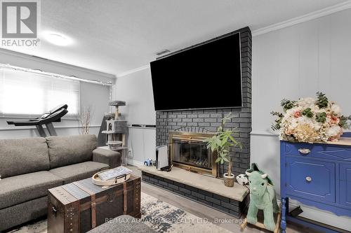 7 Lochern Road, London, ON - Indoor Photo Showing Living Room With Fireplace