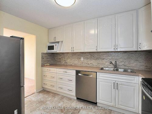 702-10 Tangreen Crt, Toronto, ON - Indoor Photo Showing Kitchen With Double Sink