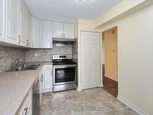 702-10 Tangreen Crt, Toronto, ON - Indoor Photo Showing Kitchen With Double Sink