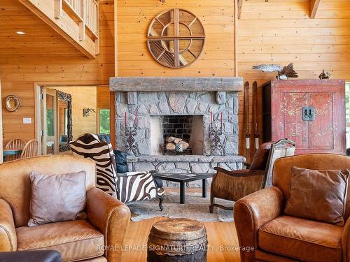 B350 Echo Island, The Archipelago, ON - Indoor Photo Showing Living Room With Fireplace