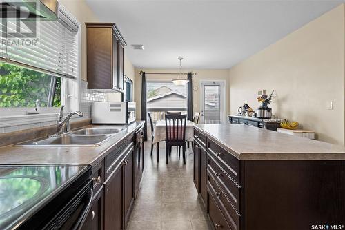 379 Levalley Cove, Saskatoon, SK - Indoor Photo Showing Kitchen With Double Sink
