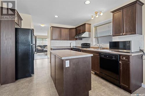 379 Levalley Cove, Saskatoon, SK - Indoor Photo Showing Kitchen With Double Sink
