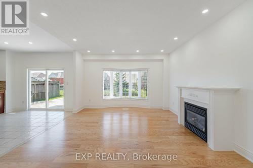 1002 Vickerman Gate, Milton (Coates), ON - Indoor Photo Showing Living Room With Fireplace