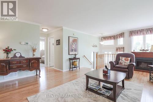 9 Samuel Place, Kawartha Lakes, ON - Indoor Photo Showing Living Room With Fireplace