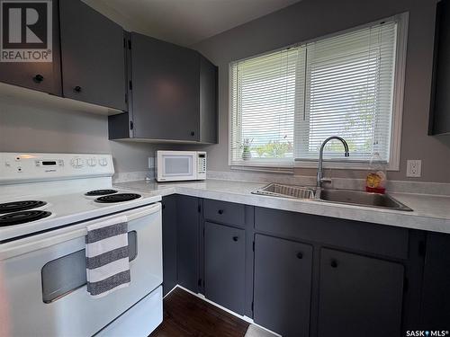 4 Clayton Street, Quill Lake, SK - Indoor Photo Showing Kitchen With Double Sink