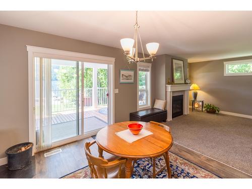 5810 Highway 3A, Nelson, BC - Indoor Photo Showing Dining Room With Fireplace